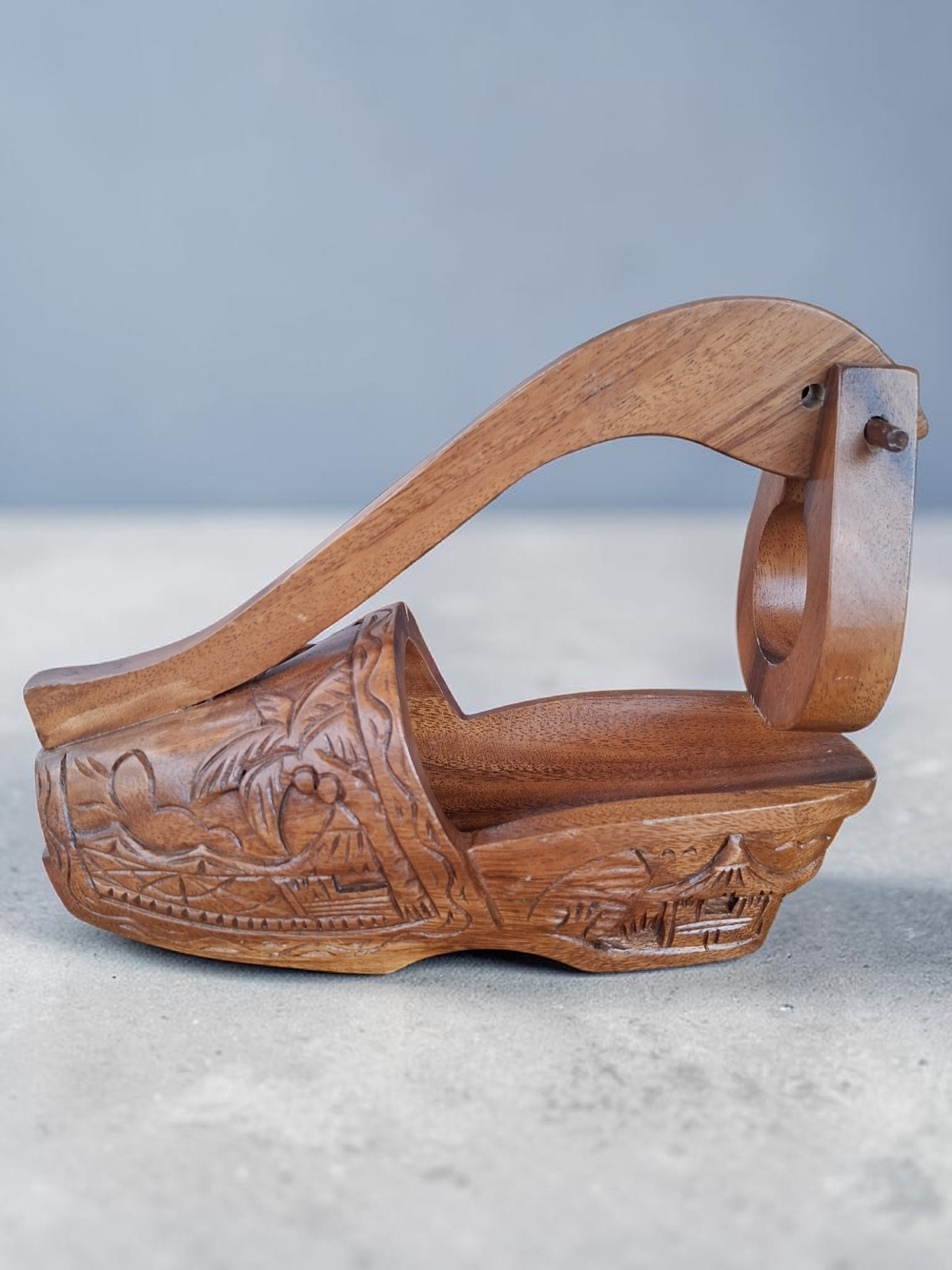 Tiki adjacent carved wood tropical island hut shoe clog wine bottle rest holder